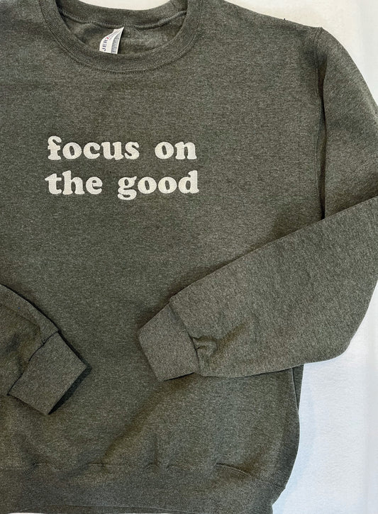 a sweatshirt with the words focus on the good on it