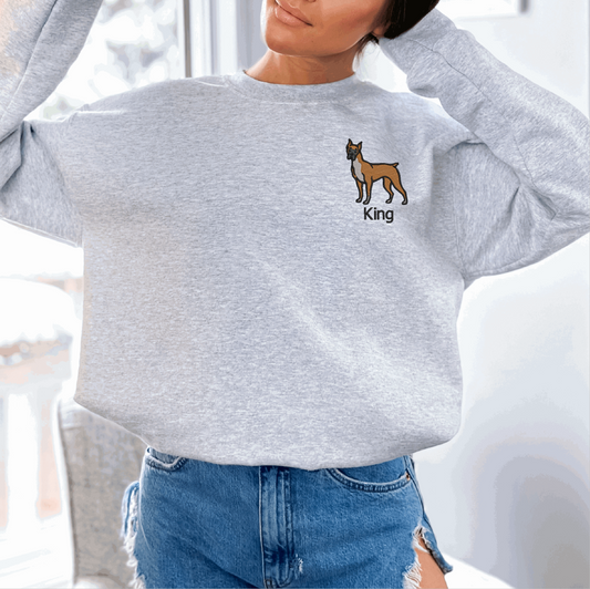 a woman wearing a sweatshirt with a dog on it